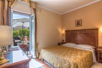 Posteľ alebo postele v izbe v ubytovaní Tmark Hotel Vaticano