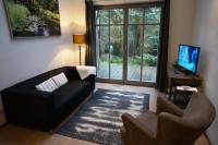 TV a/nebo společenská místnost v ubytování BluGarden Ferienapartments im Spreewald