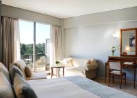 Postel nebo postele na pokoji v ubytování Golden Sun Hotel