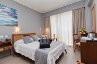 Postel nebo postele na pokoji v ubytování Golden Sun Hotel