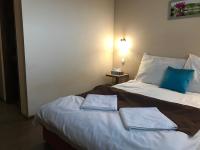 Posteľ alebo postele v izbe v ubytovaní Abszolút Hotel és Panzió