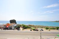 a view of a street and the ocean from a building at Hang Hai B&amp;B in Eluan