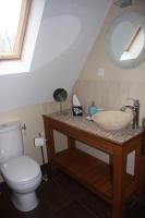 a bathroom with a sink and a toilet at Les Bouts de Rallé Chambre d&#39;Hotes in Sainte-Osmane