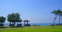 a park with benches and a gazebo near the water at 晶藍色美人魚 Mermaid Inn in Hualien City