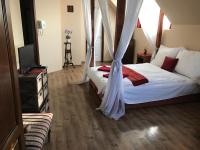 Posteľ alebo postele v izbe v ubytovaní Abszolút Hotel és Panzió