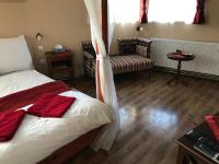 Posteľ alebo postele v izbe v ubytovaní Abszolút Hotel és Panzió