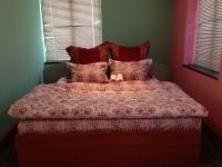A bed or beds in a room at Hotel Bilyana
