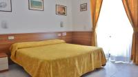 Posteľ alebo postele v izbe v ubytovaní Hotel Mignon