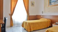 Posteľ alebo postele v izbe v ubytovaní Hotel Mignon
