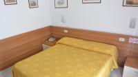 Posteľ alebo postele v izbe v ubytovaní Hotel Mignon