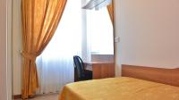 Posteľ alebo postele v izbe v ubytovaní Hotel Mignon