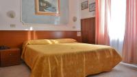 Posteľ alebo postele v izbe v ubytovaní Hotel Mignon