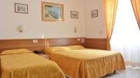 Posteľ alebo postele v izbe v ubytovaní Hotel Mignon