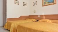 Posteľ alebo postele v izbe v ubytovaní Hotel Mignon