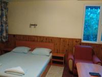 Postel nebo postele na pokoji v ubytování Nimpha Bungalows