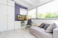 Televízia a/alebo spoločenská miestnosť v ubytovaní Apartments Aida