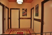 a hallway with two doors and a rug at SunAnatolia Otel in Antalya