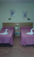 Postel nebo postele na pokoji v ubytování Hotel Los Molinos