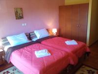 A bed or beds in a room at Hotel Aoos