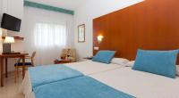 Postel nebo postele na pokoji v ubytování Hotel Verol