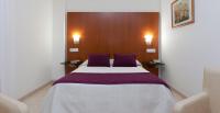 Postel nebo postele na pokoji v ubytování Hotel Verol