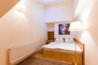 Postel nebo postele na pokoji v ubytování Hotel Maltezský Kříž