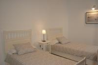 A bed or beds in a room at Harbour Lights