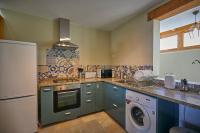 A kitchen or kitchenette at Villa Palmeras Beach Puerto del Carmen