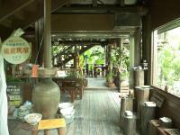 a store with a large vase on a wooden floor at Country Grange B&amp;B in Yuanshan