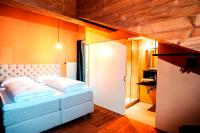 A bed or beds in a room at alpen select lodge Kleinwalsertal
