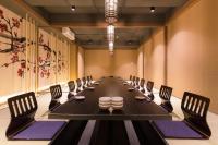 a long conference room with a long table and chairs at Bandara Suites Silom, Bangkok in Bangkok