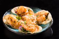 a bowl of food with shrimp on a table at Bandara Suites Silom, Bangkok in Bangkok
