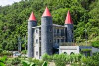 an old castle with red turrets on top of it at Zum Adler Castle B&amp;B in Jiaoxi