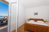 Postel nebo postele na pokoji v ubytování Apartmani Gaube