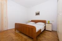 Postel nebo postele na pokoji v ubytování Apartmani Gaube