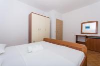 Postel nebo postele na pokoji v ubytování Apartmani Gaube
