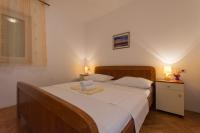 Postel nebo postele na pokoji v ubytování Apartmani Gaube