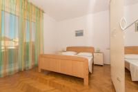 Postel nebo postele na pokoji v ubytování Apartmani Gaube