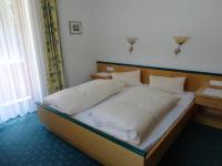 A bed or beds in a room at Ferienhaus Regina