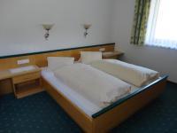 A bed or beds in a room at Ferienhaus Regina