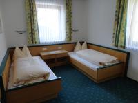 A bed or beds in a room at Ferienhaus Regina