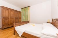 Postel nebo postele na pokoji v ubytování Apartmani Gaube