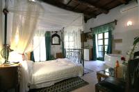 Posteľ alebo postele v izbe v ubytovaní Ifigenia Traditional Rooms & Maisonettes