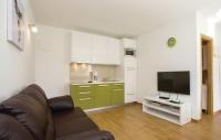 Televízia a/alebo spoločenská miestnosť v ubytovaní Apartman Prima