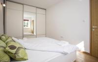 Posteľ alebo postele v izbe v ubytovaní Apartman Prima