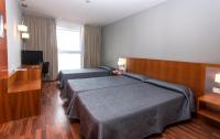 Postel nebo postele na pokoji v ubytování Hotel AG Express Elche