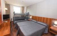 Postel nebo postele na pokoji v ubytování Hotel AG Express Elche