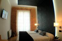 Postel nebo postele na pokoji v ubytování Hostal Oriente