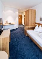 Hotel Rössli Tufertschwilにあるベッド