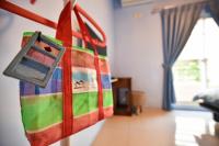 a bag hanging on a wall in a room at Lane Homestay in Dayin